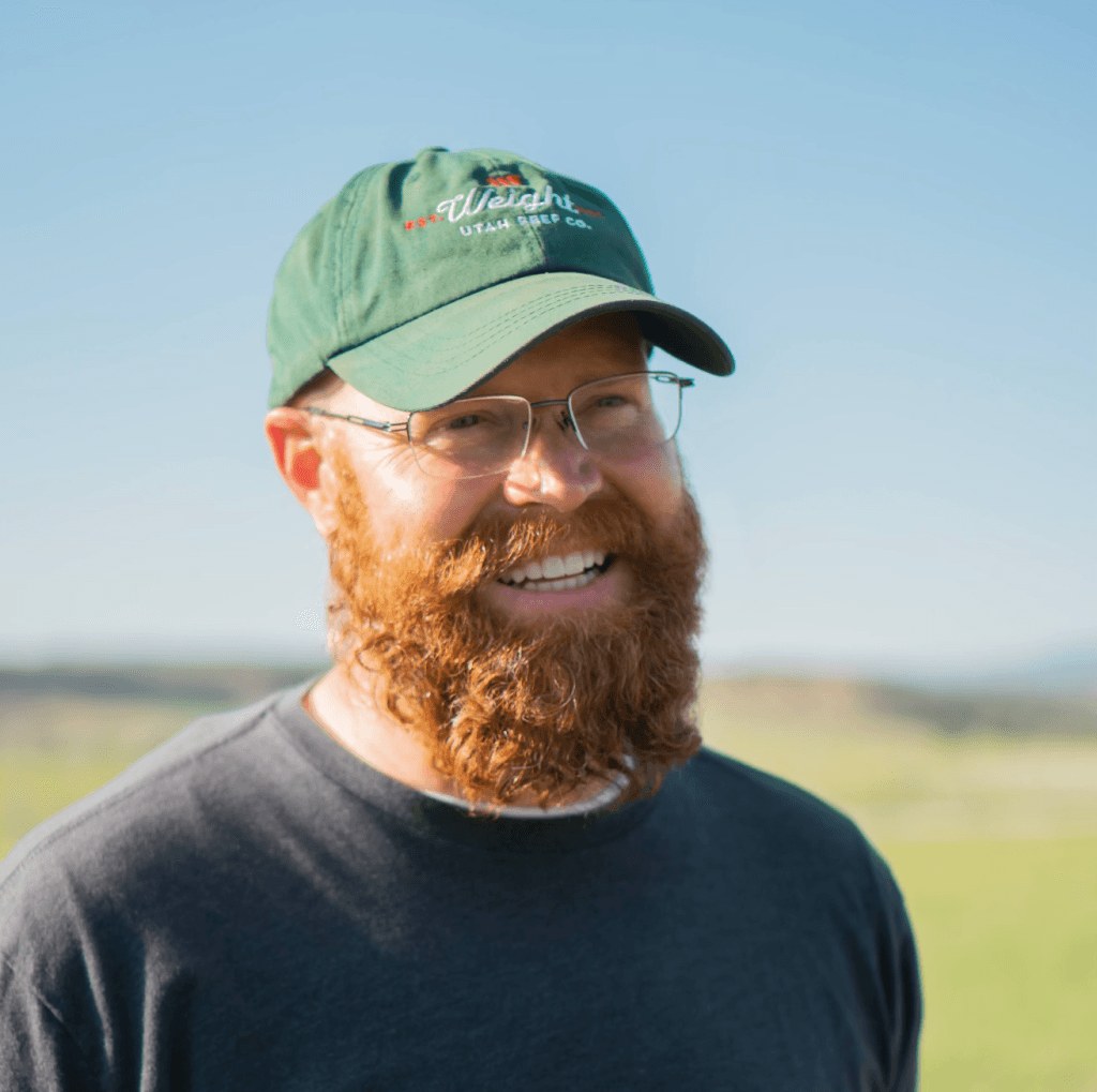 Mitch Weight, Dwelt founder, wearing a green hat on rural land
